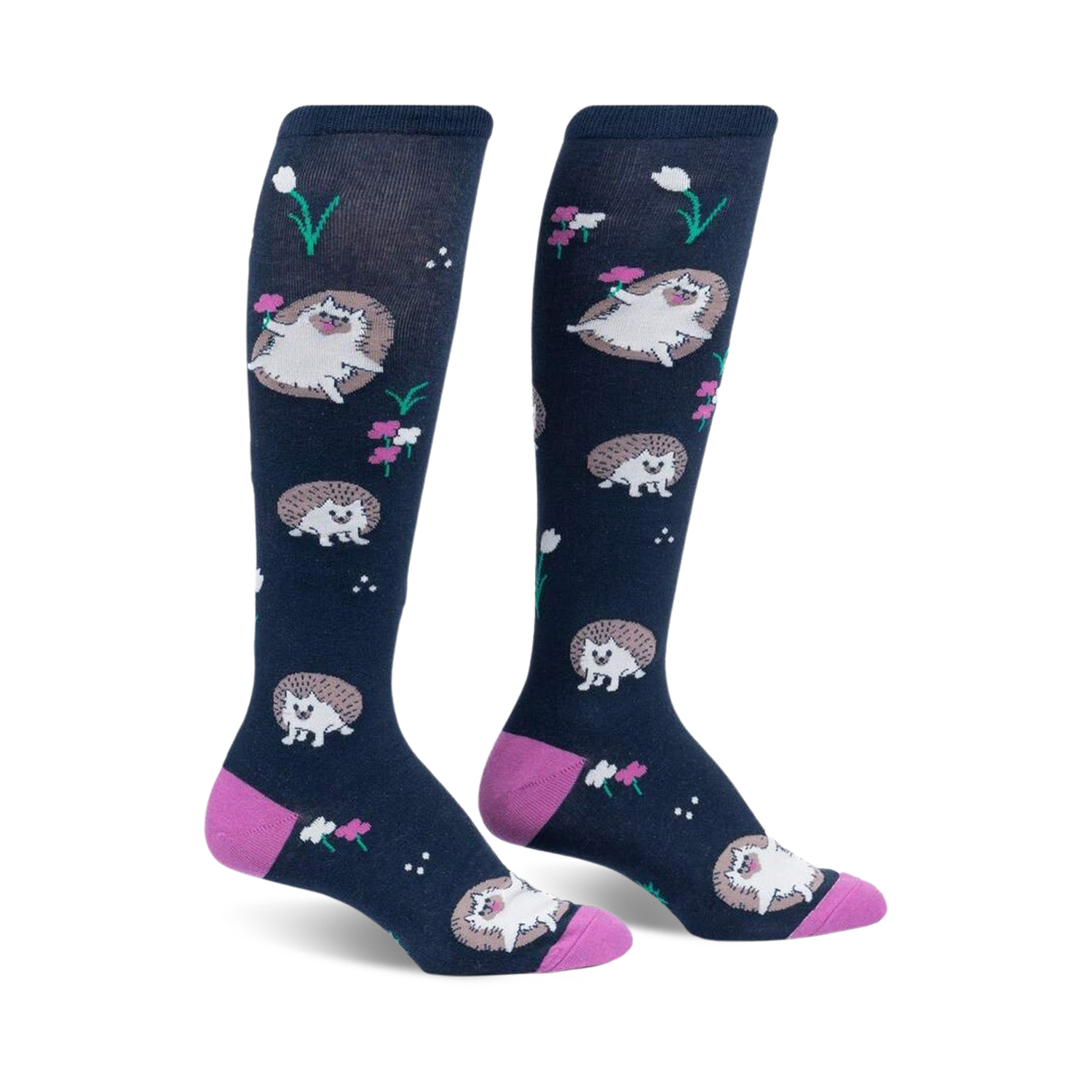 Pair of navy blue knee-high socks with a repeating pattern of cute hedgehogs and pink flowers.  Pink heel and toe.