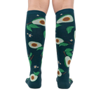 Back view of the teal avocado knee-high socks on a person's legs.