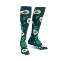 Pair of teal knee-high socks with a fun avocado and leaf pattern. The avocados are various shades of green.
