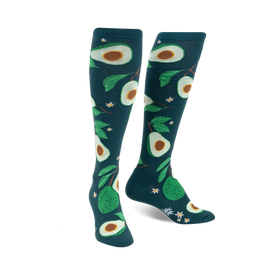 teal knee-high socks with an all-over pattern of avocados, avocado leaves, and white flowers.   
