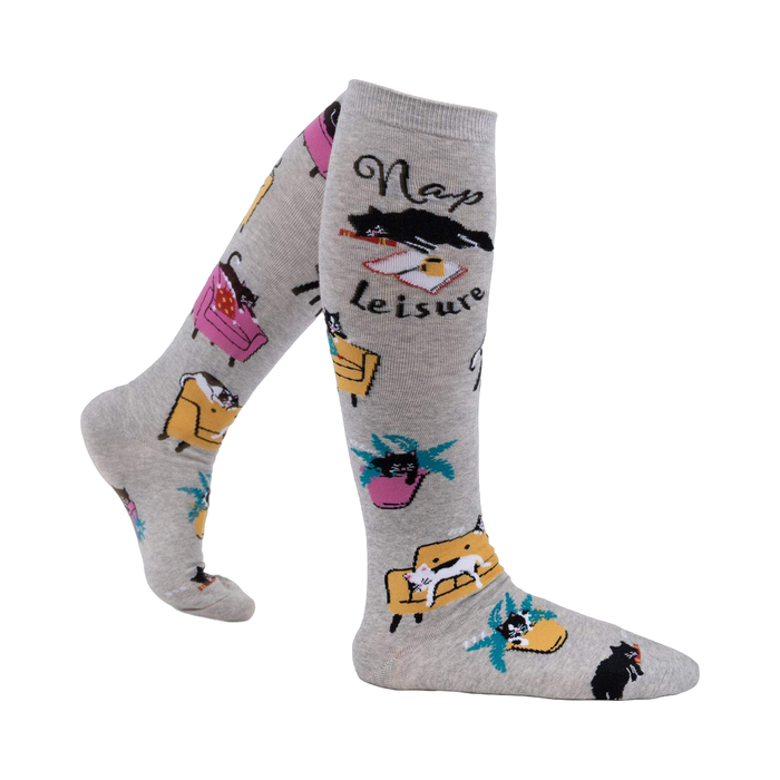 Lifestyle shot of a person wearing the 'Nap Leisure' knee-high socks, showcasing the design and fit.