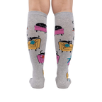 Back view of the 'Nap Leisure' knee-high socks on a person's legs, showing the full design and pattern repeat.