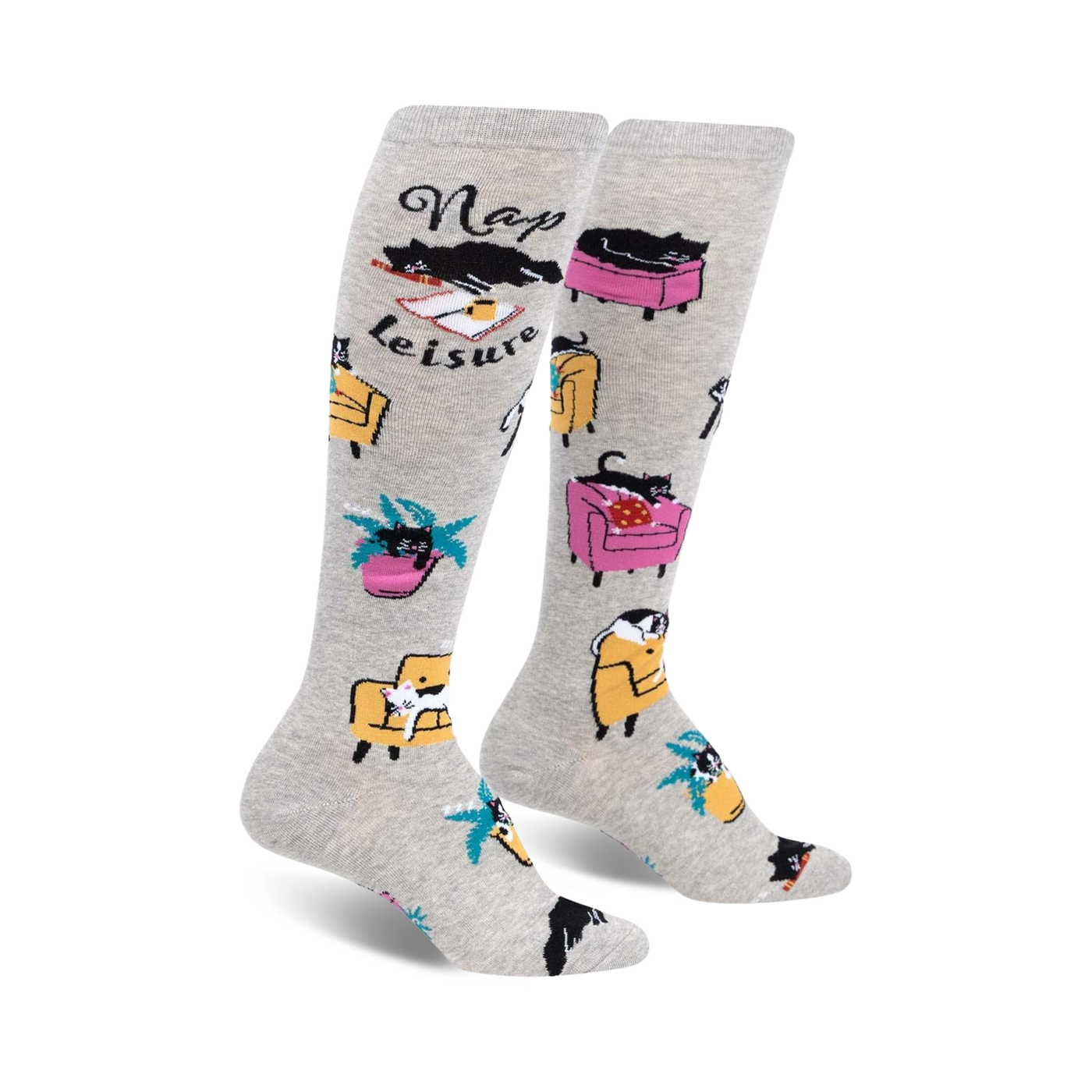 Pair of grey knee-high socks with black cats napping in armchairs and the words 'Nap Leisure'.  Features yellow and pink armchairs and palm trees.