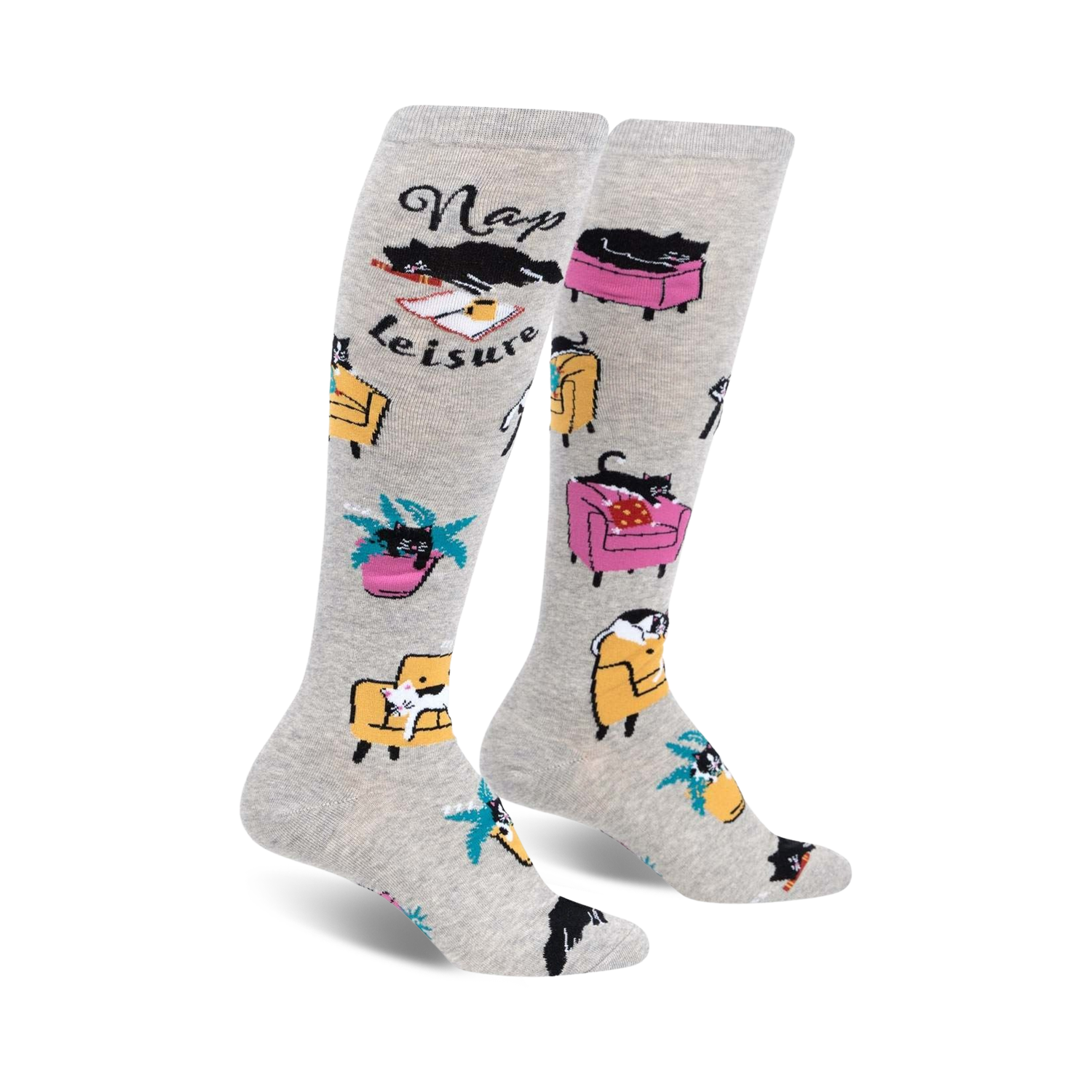Pair of grey knee-high socks with black cats napping in armchairs and the words 'Nap Leisure'.  Features yellow and pink armchairs and palm trees.