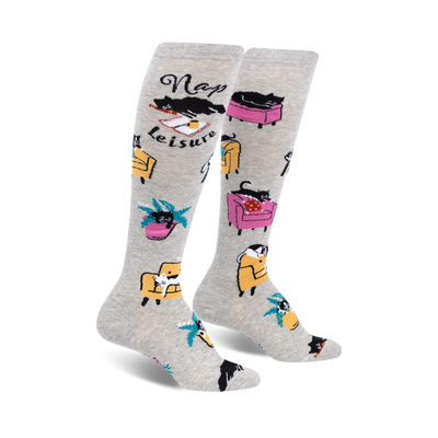 gray cat nap leisure knee-high socks with black cats on pink and yellow furniture.   