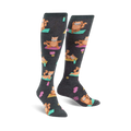 Pair of charcoal gray knee-high socks featuring a repeating pattern of red pandas doing yoga poses on teal yoga mats. 