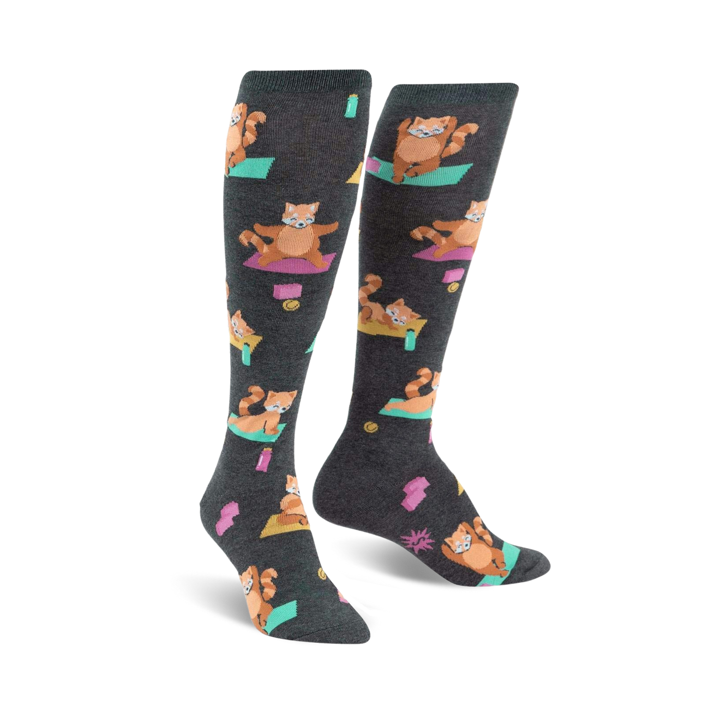 Pair of charcoal gray knee-high socks featuring a repeating pattern of red pandas doing yoga poses on teal yoga mats. 