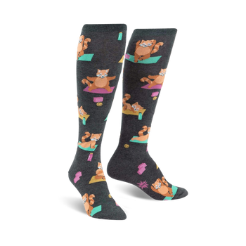 gray knee-high women's socks feature red pandas practicing yoga poses.  