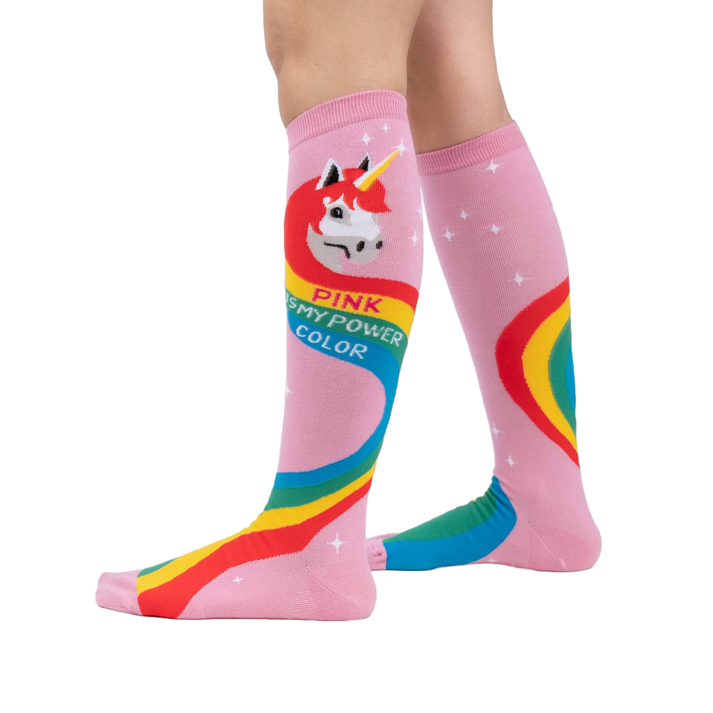 Lifestyle shot showing the Rainbow Mane socks on a model's legs.