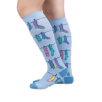 Lifestyle shot of a person wearing the Socks on Socks knee-high socks, showing the socks on their legs against a white background.