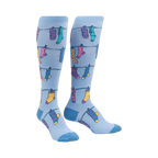 Flat lay product shot of a pair of Socks on Socks knee-high socks, highlighting the details of the fun socks-on-a-clothesline design.
