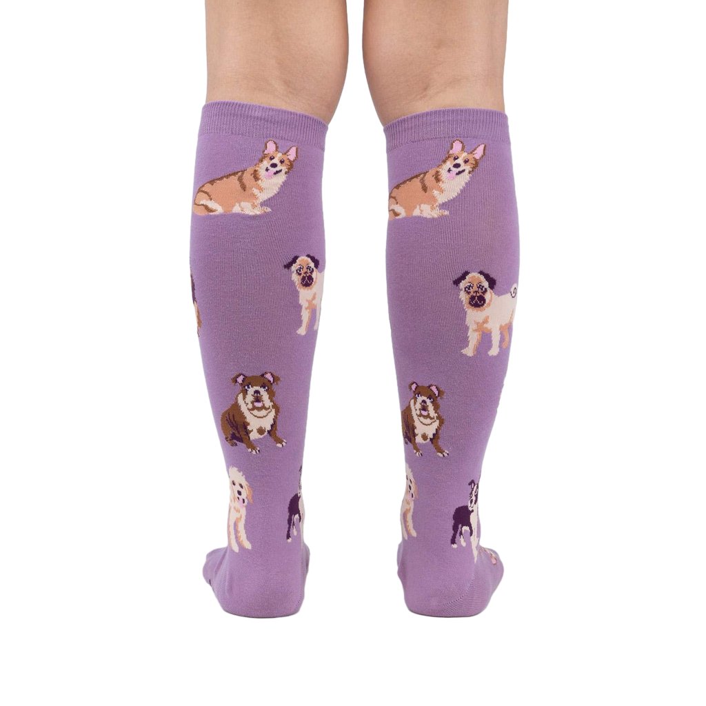 Back view of a person wearing the lavender purple knee-high socks. The dog illustrations are visible.
