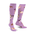 Pair of lavender purple knee-high socks featuring a pattern of various dog breeds in illustrated style.