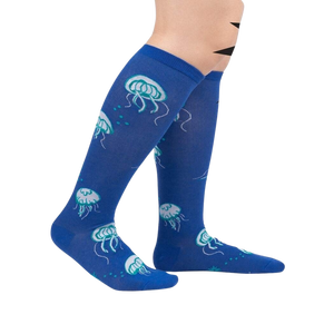 A pair of blue knee-high socks with a pattern of jellyfish.