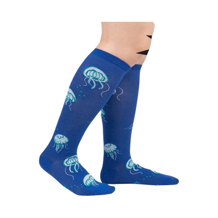 Lifestyle shot showing the 'Nice to Sea You' socks on a person's legs, showcasing the fit and style.