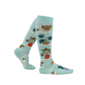 Lifestyle shot of a person wearing the Hen and Chicks knee-high socks, showing the socks from the side.