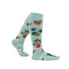 Lifestyle shot of a person wearing the Hen and Chicks knee-high socks, showing the socks from the side.