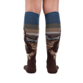 Back view of a pair of Mona Lisa socks lying flat, showcasing full design.