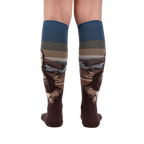 Back view of a pair of Mona Lisa socks lying flat, showcasing full design.