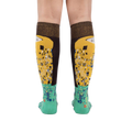 Rear view of The Kiss socks on a model, highlighting the full design on both socks.