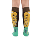 Rear view of The Kiss socks on a model, highlighting the full design on both socks.