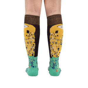 Rear view of The Kiss socks on a model, highlighting the full design on both socks.