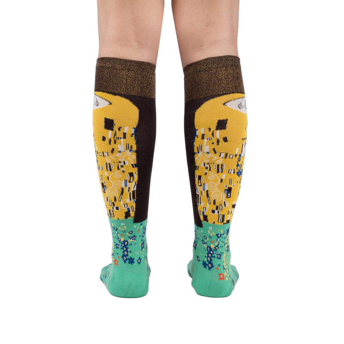Rear view of The Kiss socks on a model, highlighting the full design on both socks.