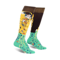 Pair of women's knee-high socks.  One side features Klimt's The Kiss in gold and brown, the other a teal floral pattern.  Brown cuff with gold shimmer.