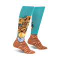 Pair of teal knee-high socks with a colorful sunflower design based on Van Gogh's painting.  Brown accents at the bottom.