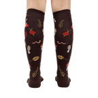 Rear view of 'Down to Earth' knee-high socks showing the full pattern and design on the back of the socks.
