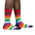 Lifestyle shot of a person's legs wearing the Streets of Pride socks, showcasing how they look when worn.
