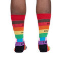 Lifestyle shot of a person's legs wearing the Streets of Pride socks, showcasing how they look when worn.