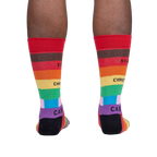 Lifestyle shot of a person's legs wearing the Streets of Pride socks, showcasing how they look when worn.