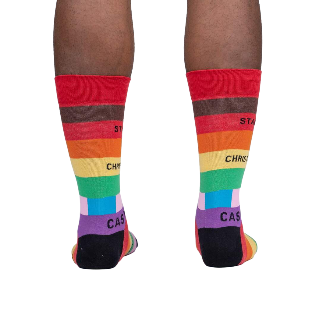 Lifestyle shot of a person's legs wearing the Streets of Pride socks, showcasing how they look when worn.