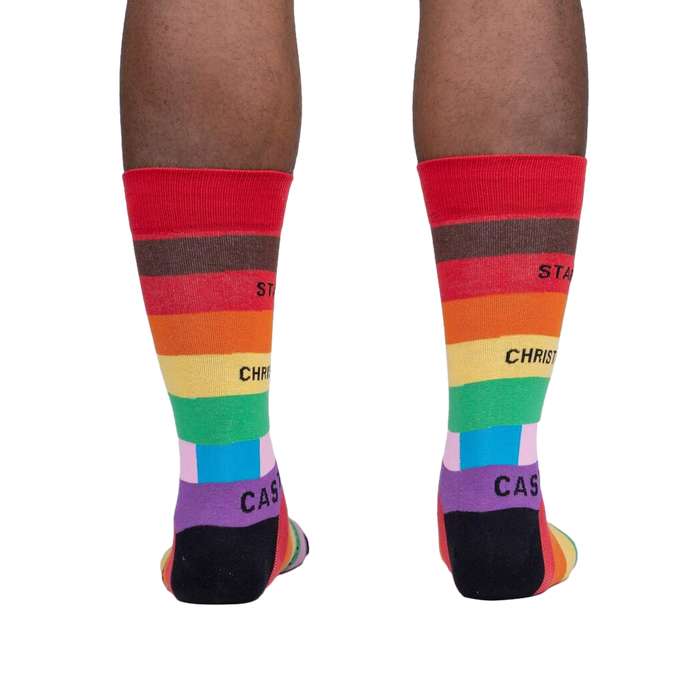Rear view of a person's legs wearing the Streets of Pride socks, showcasing the back design.