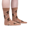 Lifestyle shot of a person wearing the Bigfoot beer socks, showing the socks on their legs.