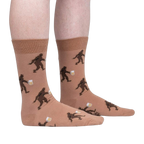 Lifestyle shot of a person wearing the Bigfoot beer socks, showing the socks on their legs.