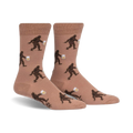 Tan crew socks with a repeating pattern of brown Bigfoot figures carrying mugs of beer.