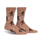 Tan crew socks with a repeating pattern of brown Bigfoot figures carrying mugs of beer.