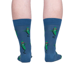 Rear view of model's legs wearing the blue crew socks with dancing pickle design.