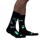 Close-up of the 'Game On' socks, highlighting the glowing details in the dark. The image emphasizes the glow-in-the-dark feature.