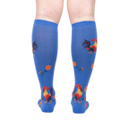 Rear view of model wearing Rise and Shine knee-high socks; showcasing the full sock design.