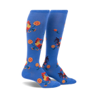 Pair of blue knee-high socks with a repeating pattern of roosters and yellow flowers.  Fun and colorful!