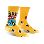 Crew socks in mustard yellow with a 'Brewmaster' design. Features beer bottles, mugs, and other beer-related graphics.