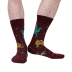 Lifestyle shot of a model's legs wearing the Beasts of Yore socks, showing the socks on feet.