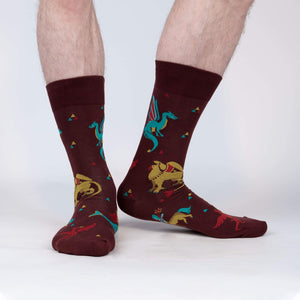 A pair of maroon crew socks with a pattern of dragons and phoenixes in flight.