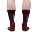 Rear view of a model's legs wearing the Beasts of Yore socks, highlighting the back design of the socks.