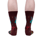 Rear view of a model's legs wearing the Beasts of Yore socks, highlighting the back design of the socks.