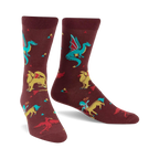 Burgundy crew socks featuring dragons, griffins, and phoenixes in teal, yellow, and red. Small triangles are scattered across the background.