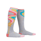 Lifestyle shot of a person wearing the 'It's Magic' knee-high socks, showing the socks' design and fit.
